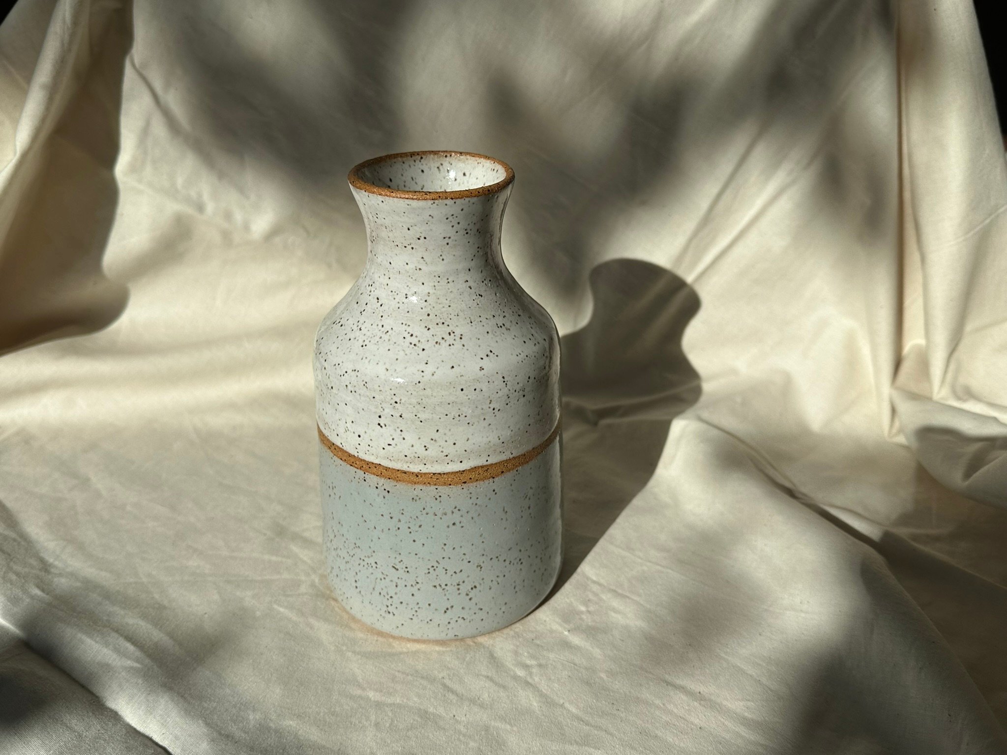 speckled white and silver vase